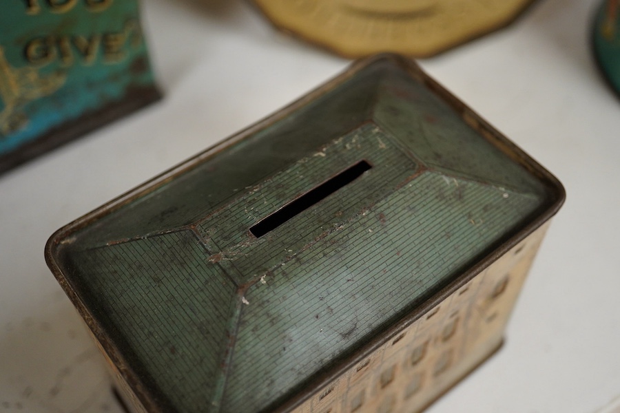 A quantity of various painted tin money boxes including Lucie Attwell Fairy House, The ‘Daily Mail’ copper bank, and four in the form of books, largest 20cm high. Condition - mostly fair